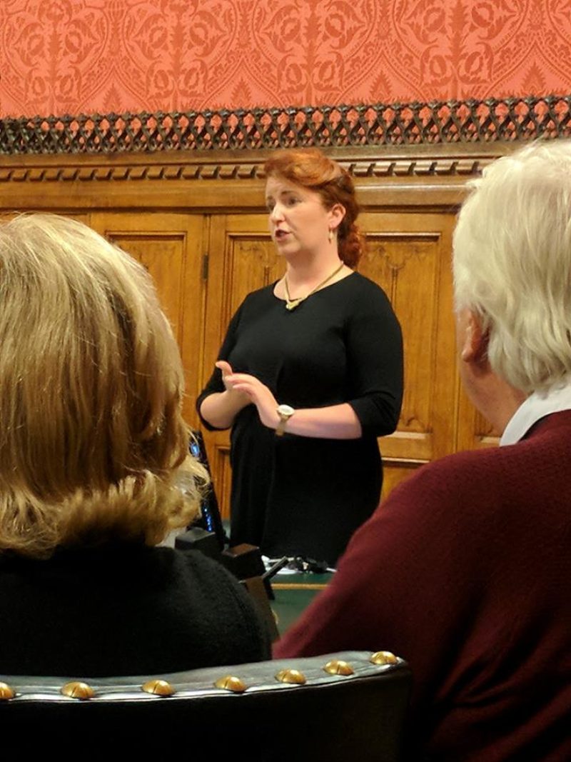 Louise speaking to constituents in Parliament
