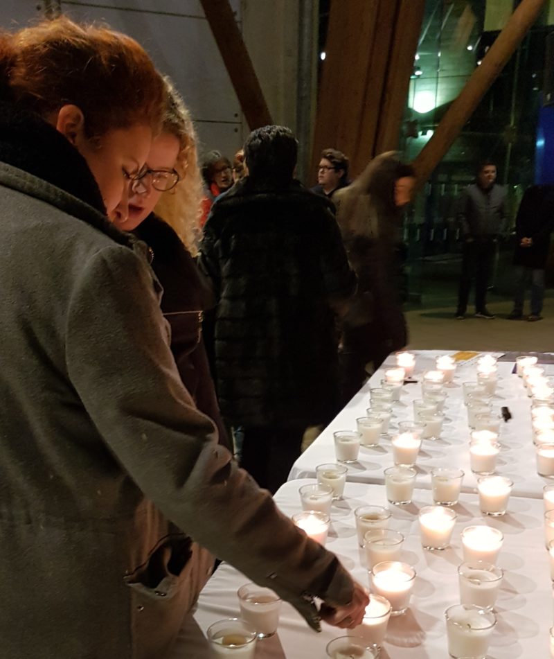 Louise lighting candles for Holocaust Memorial Day.